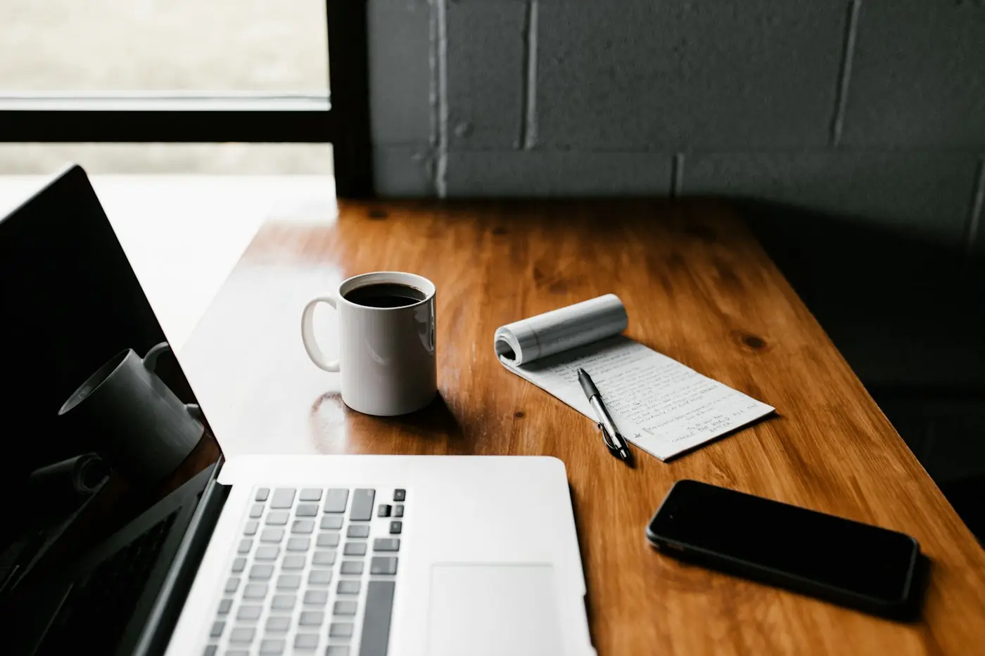 Content writer planning SEO blog content at a laptop