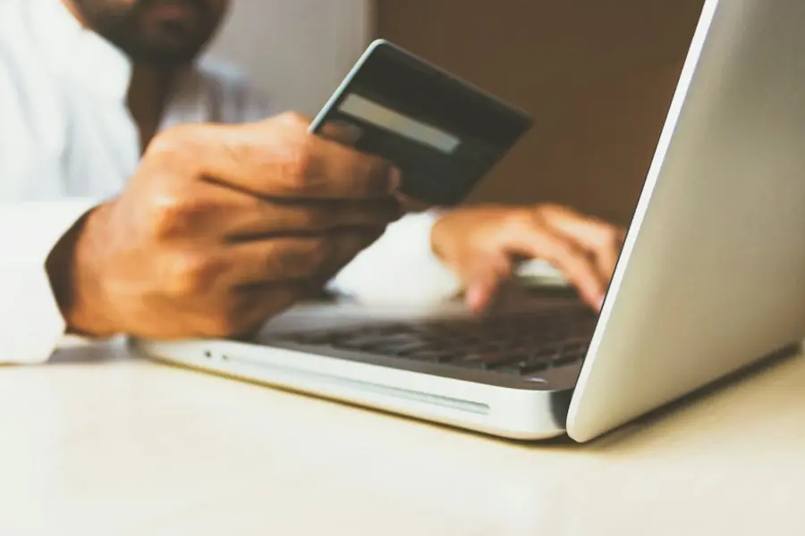 Customer paying online with a credit card on a laptop