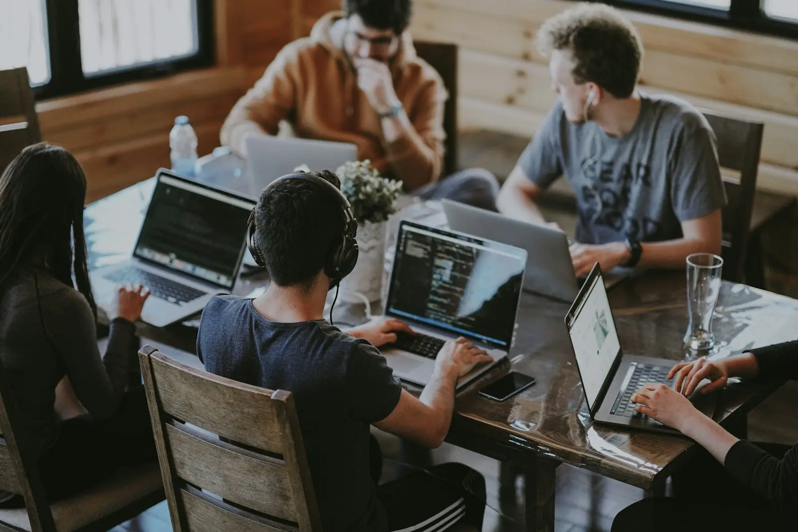 Business team discussing a marketing plan around a table