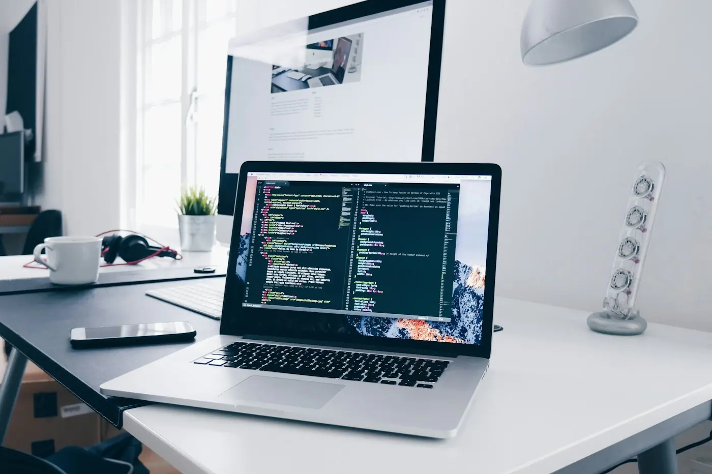 Website development code on a laptop screen